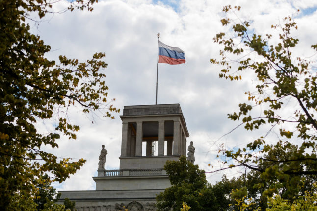 The Russian flag flies on top of the Russian embassy in Berlin.