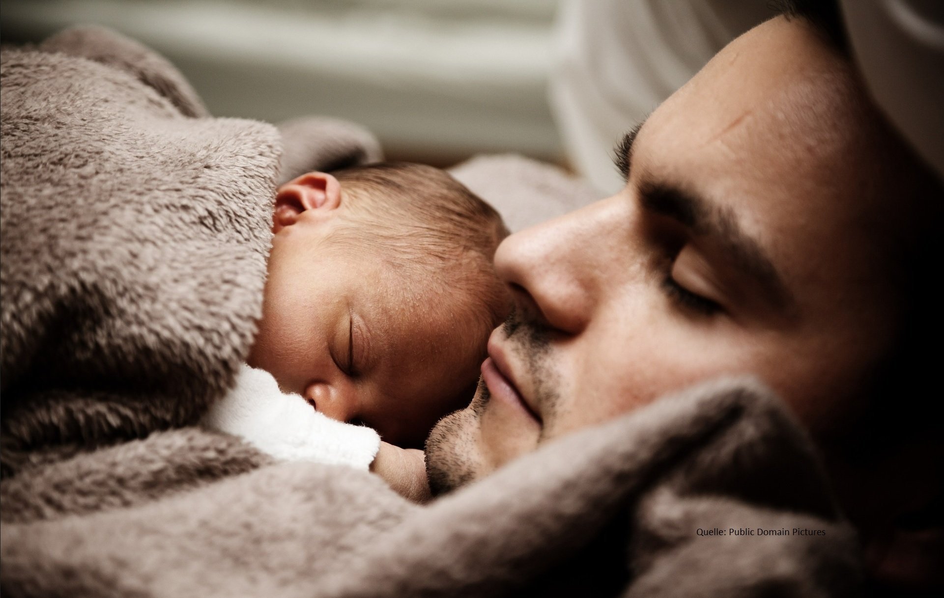 A father and newborn baby
