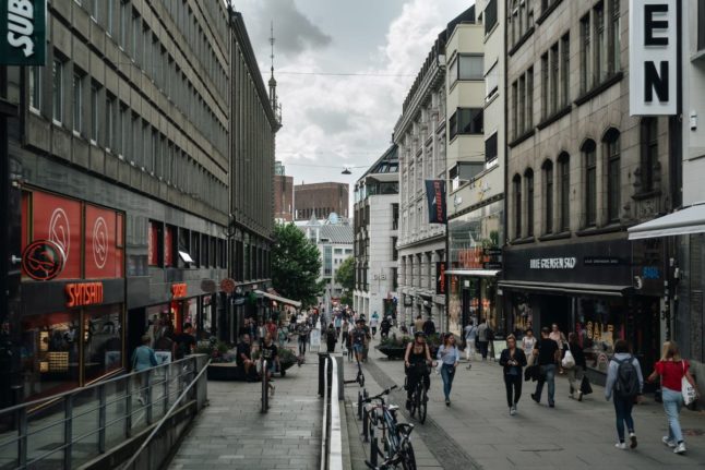 Pictured are crowds on a busy Oslo street.