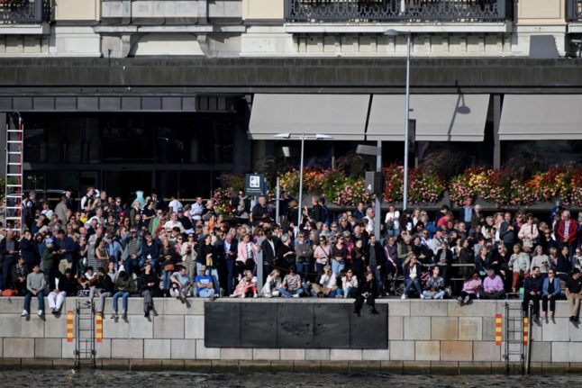 Spectators crowd to watch Sweden's King and Queen during festivities to celebrate the 50th anniversary of Sweden's King Carl XVI Gustaf's accession to the throne at the Royal Palace in Stockholm, Sweden, on September 16, 2023