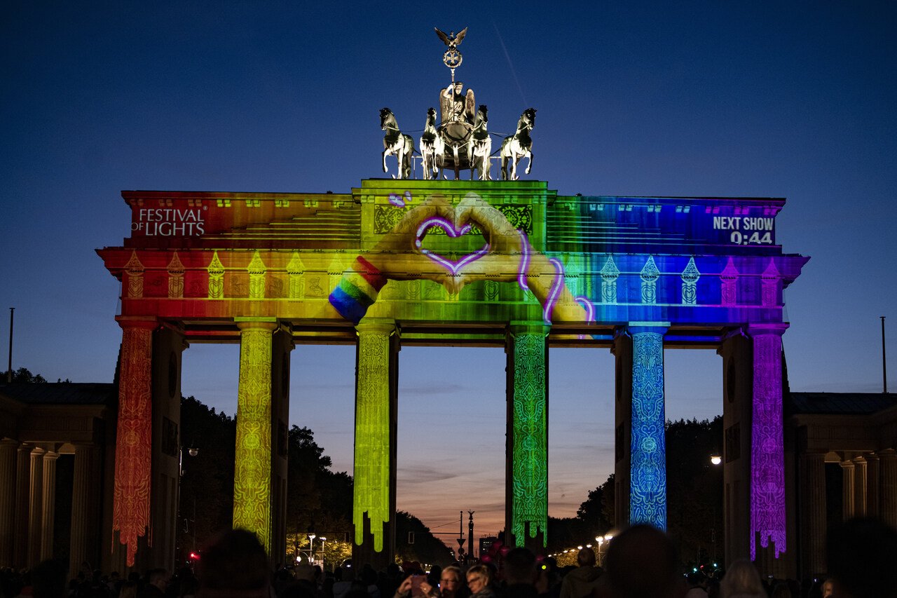 The Brandenburg Gate  lit up in rainbow colours in the Festival of Lights 2022. 