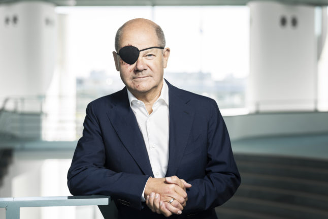 German Chancellor sparks pirate memes with eye-patch photo