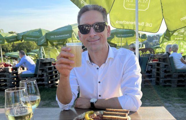 Stylianos Stavridis, founder of Exclusive Wine Experiences in Vienna enjoys a drink of Sturm at the Kahlenberg hill.