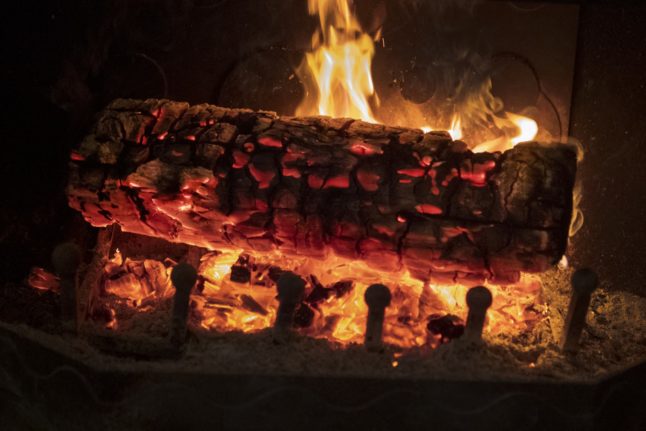 A log burning in a fireplace
