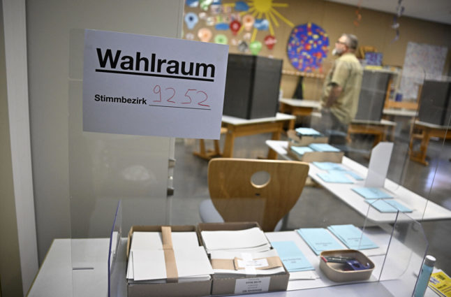 Ballot papers are placed on desks at a polling station in Nuremberg, southern Germany, during regional elections in Bavaria