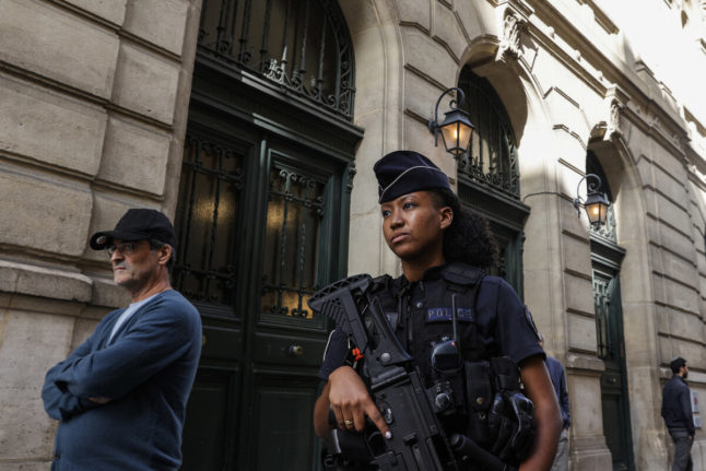 A French police officer carrying a G36 assault rifle patrols outside the Tournelles Synagogue, after increased security measures were put in place at Jewish temples and schools, in central Paris