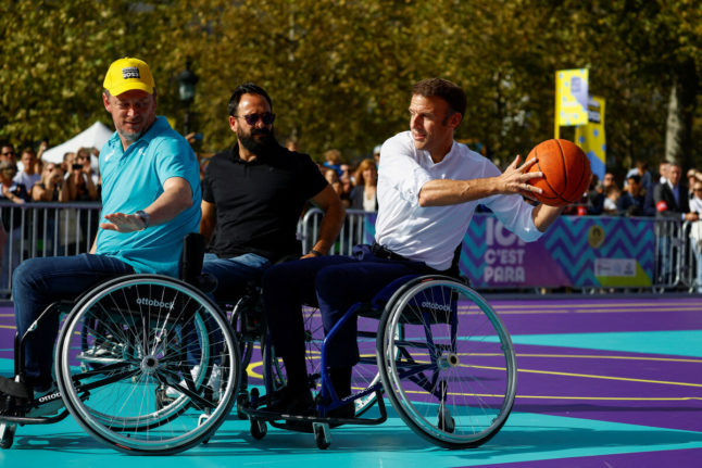 Macron tries wheelchair basketball to urge French to support 2024 Paralympics