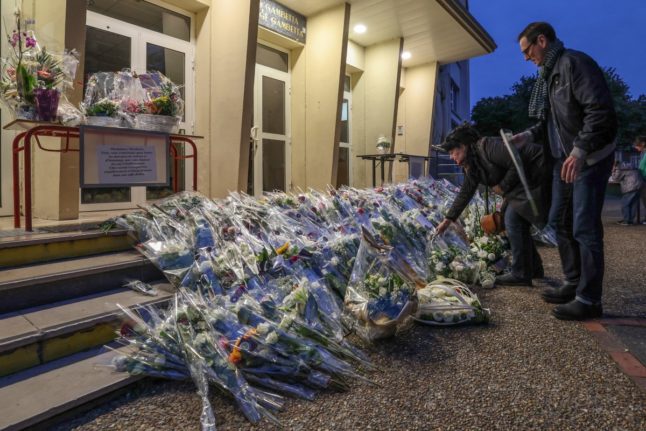 Flowers for murdered teacher Dominique Bernard outside the school in Arras where he was killed