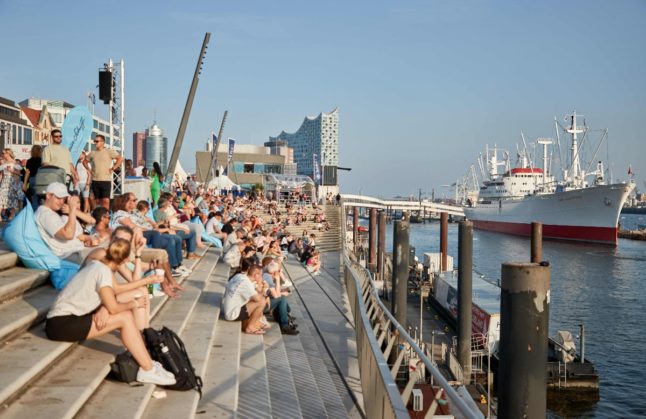People enjoy sunny weather in Hamburg.