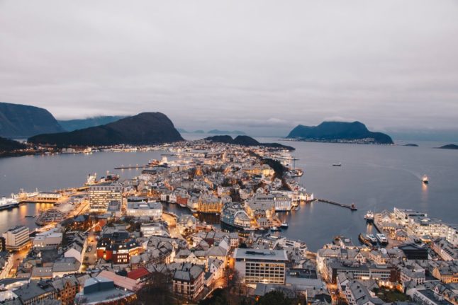 Pictured is the city of Ålesund at night from a viewpoint.