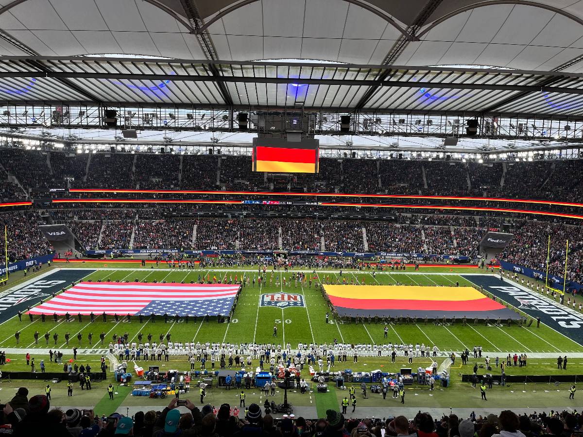 Flags are rolled out across the stadium in Frankfurt before the game.