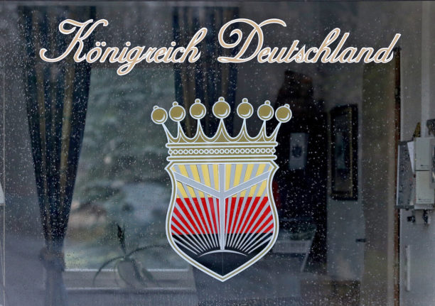 A “Kingdom of Germany” logo on a window in Wittenberg.