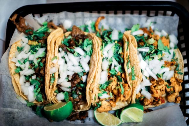 Pictured are tacos on a serving tray.