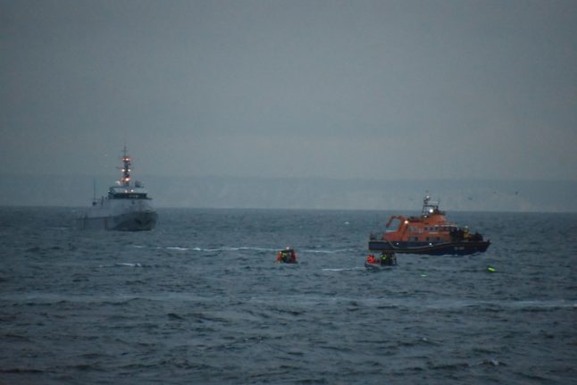 This French Navy photo from August 12, 2023 shows a MSC Taku CPP British boat (L) and a Cormoran public service patrol boat of the French Navy taking part in a search and rescue operation following the sinking of a migrant boat off Calais