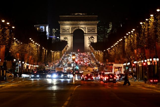 Paris' Champs Elysee avenue with the Arc de Triomphe in the background.