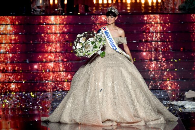 Newly elected Miss France 2024, Miss Nord-Pas-de-Calais, Eve Gilles reacts after winning the Miss France 2024 beauty pageant in Dijon, central-eastern France