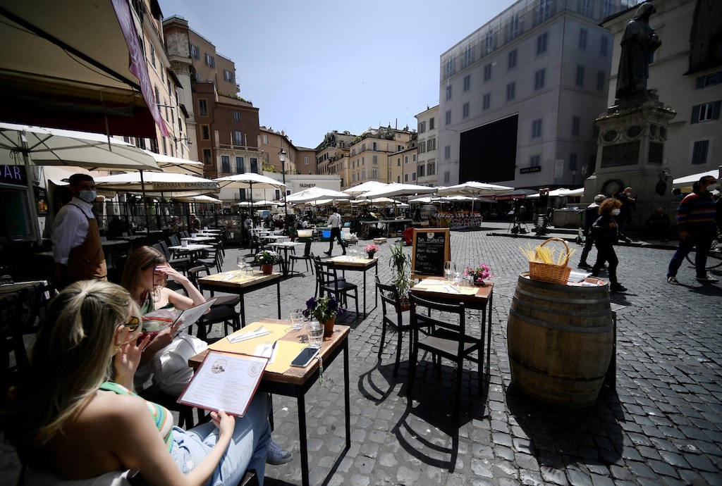 People at a restaurant in Campo dei Fiori square in central Rome.