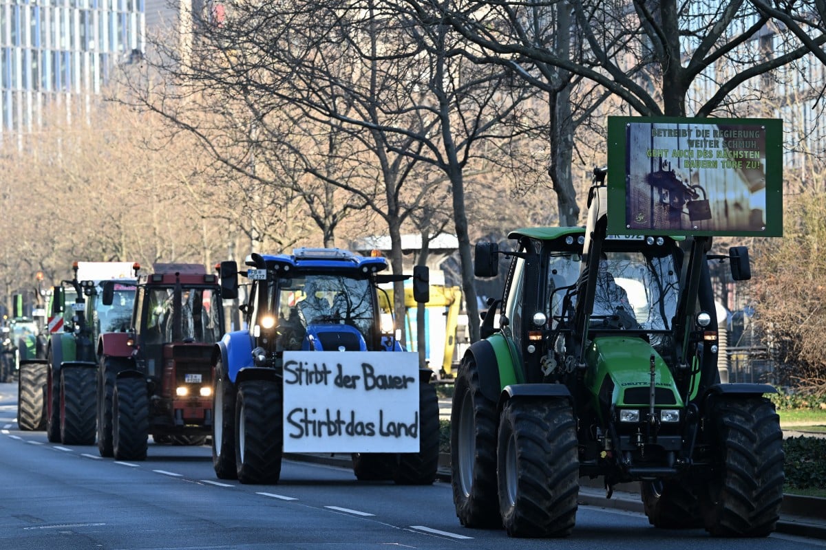 Farmers demonstrate against government plans to scrap diesel tax subsidies for agriculture vehicles in Frankfurt, western Germany,