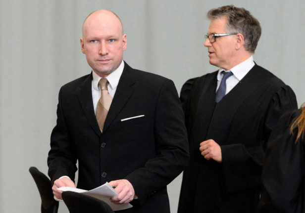 Pictured is terrorist and mass murderer Anders Behring Breivik (L) and his lawyer during a hearing in 2016.
