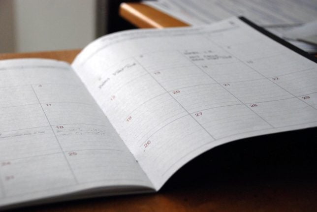 Pictured is a notepad with a calendar.