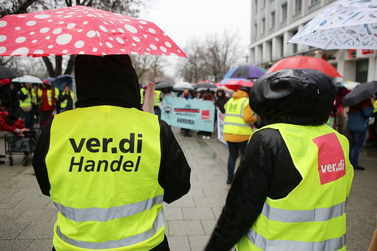 People wear Verdi vests during a strike in the retail sector in Hanover before Christmas.