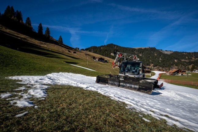 A snowcat parked on remaining snow at Adelboden Swiss alpine resort, on January 6th, 2023. Due to the lack of snow, several mid-altitude ski resorts had to close in Switzerland, and some resorts are struggling this year.