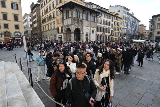 Tourists queue to enter in the Duomo in Florence, on February 15, 2024.