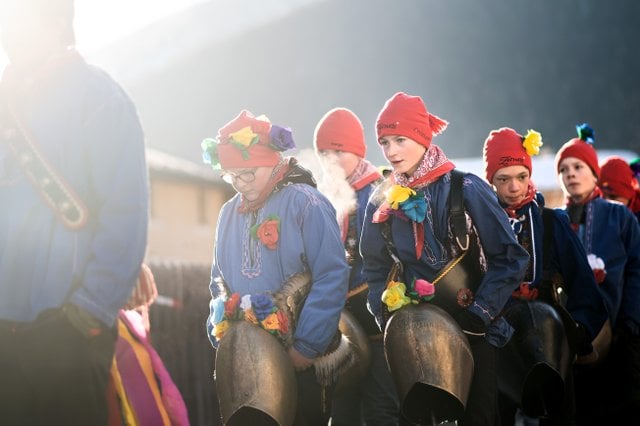 Young boys prepare to scare away winter during a Chalandamarz procession in the Canton of Graubunden.