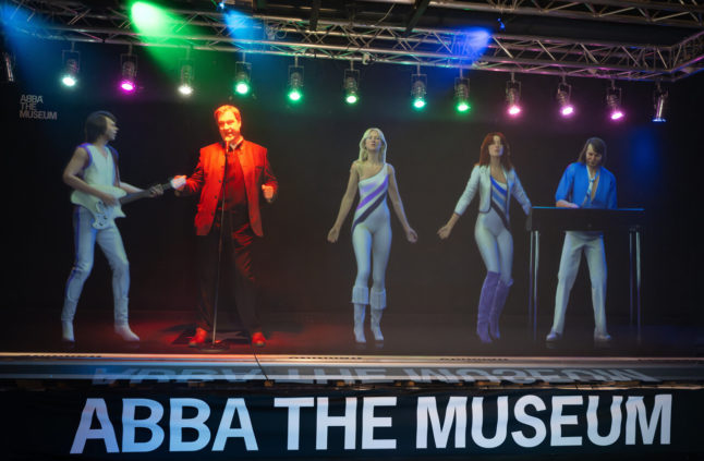 Why is Bavaria's premier singing with ABBA on stage during an official visit to Sweden?