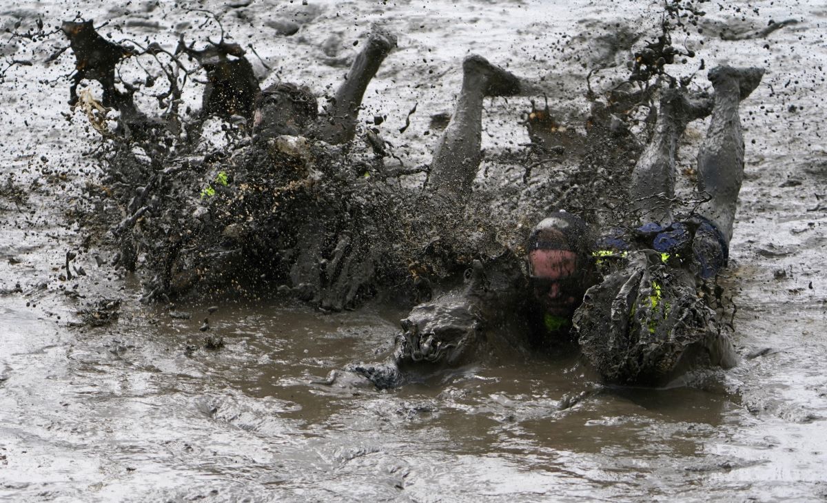 two men in mud