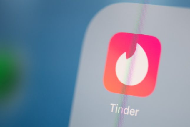 This illustration picture shows the logo of the US social networking application Tinder on the screen of a tablet.