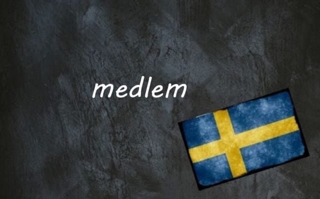 the word medlem written on a blackboard next to the swedish flag