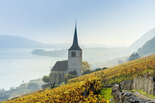Why do companies in Switzerland have to pay church taxes?