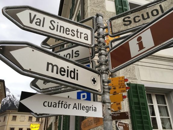 Why and how often do Swiss towns change their official language?