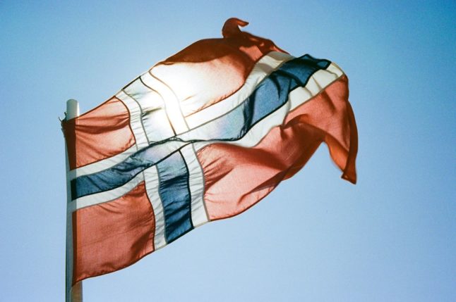Pictured is the Norwegian flag in the sunlight.