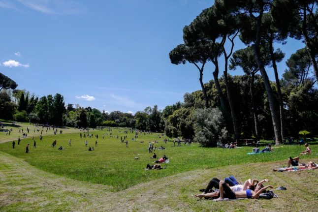 People enjoy a sunny day at the Villa Ada park in Rome