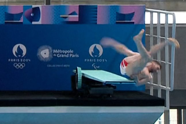 French diver laughs off 'funny' fall in front of Macron
