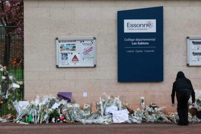Flowers outside a school in Essonne, following a fatal attack on a pupil