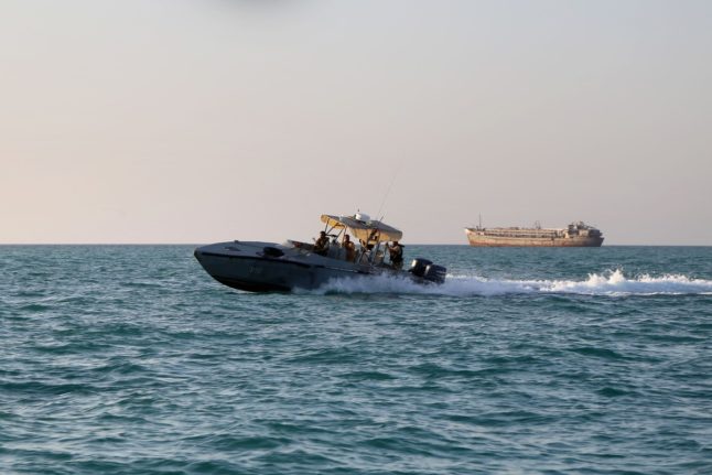 Yemeni coastguards loyal to the internationally recognised government ride in a patrol boat in the Red Sea off the government-held town of Mokha in the western Taiz province