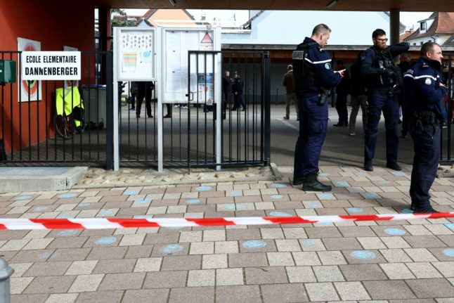 Gendarmes control the access to a school in the eastern France city of Souffelweyersheim while investigations are underway after two girls were wounded in a knife attack outside the school