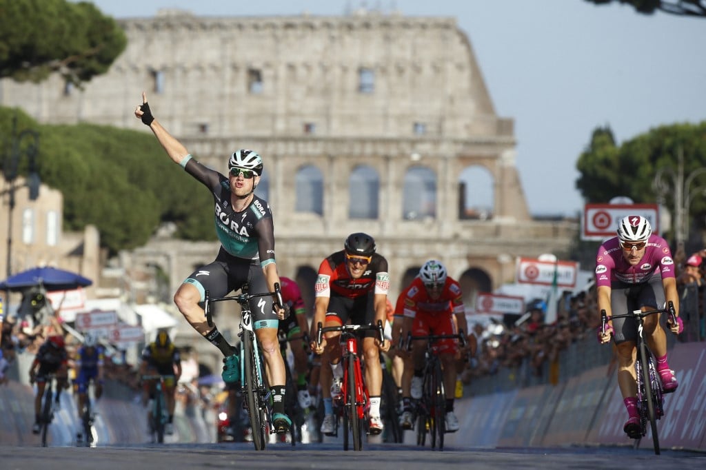 Irish rider Sam Bennett celebrates as he crosses the finish line to win the last stage of the 101st Giro d'Italia