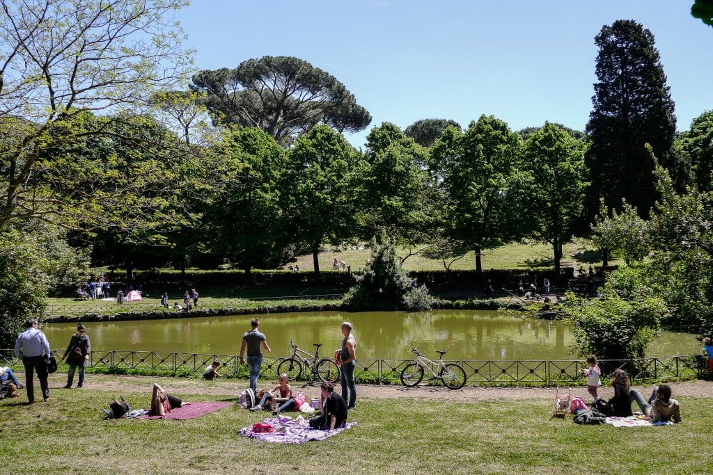 People enjoy a sunny day at Rome's Villa Ada park 
