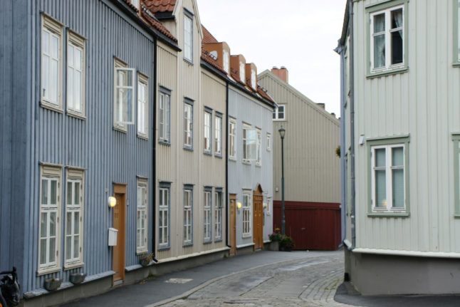 Pictured are streets with wooden houses in Trondheim.