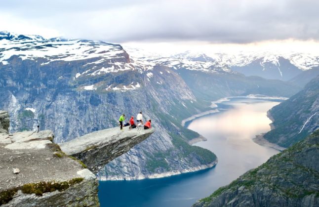 Pictured is a group of tourists at Trolltunga.