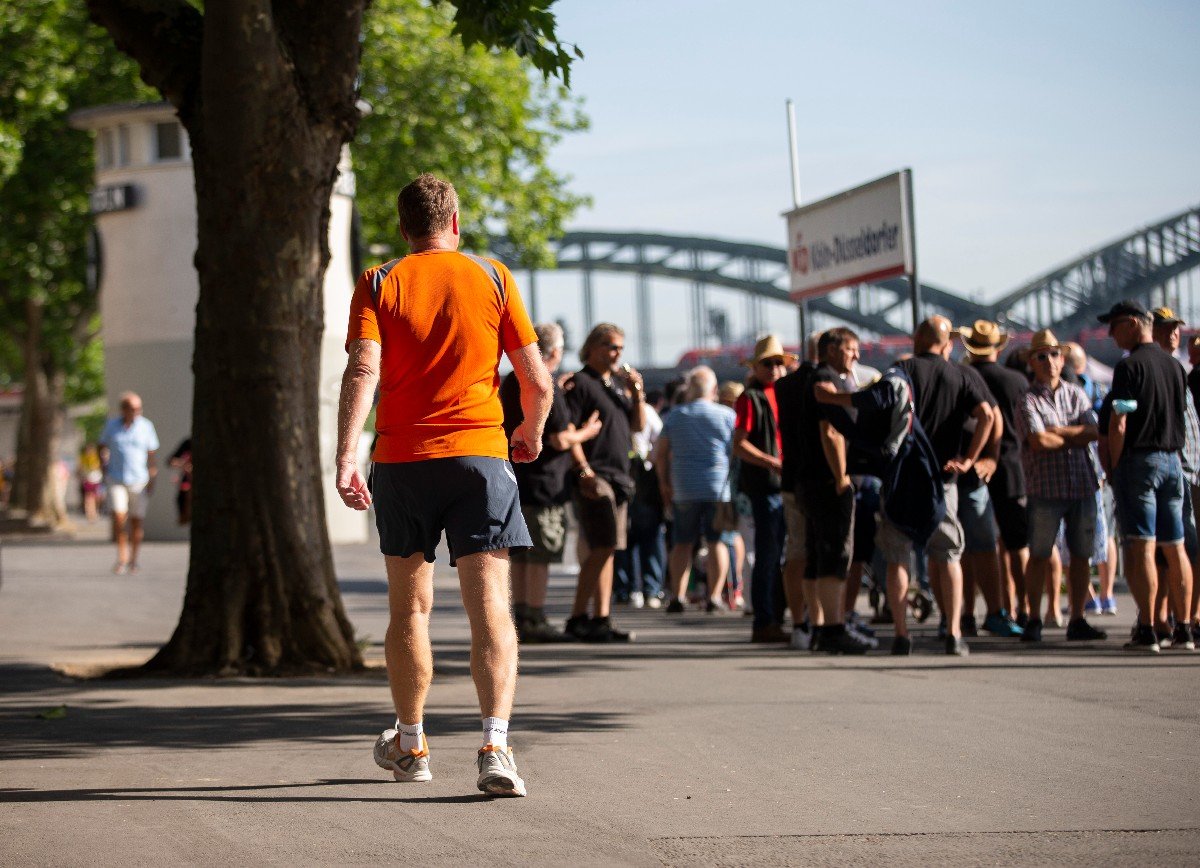 People on the Rhine promenade in Cologne.