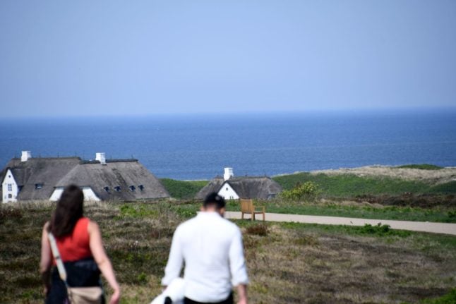 Outrage after partygoers filmed shouting racist chants on German island of Sylt