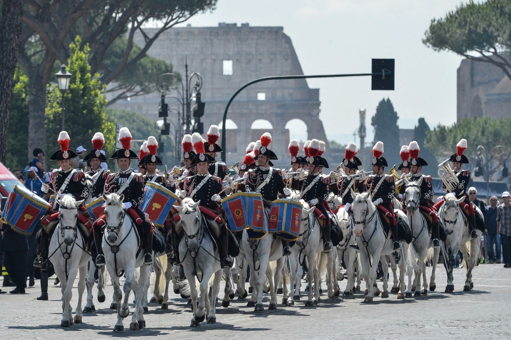 Members of Italy's Carabinieri force parade on horses in central Rome on Republic Day