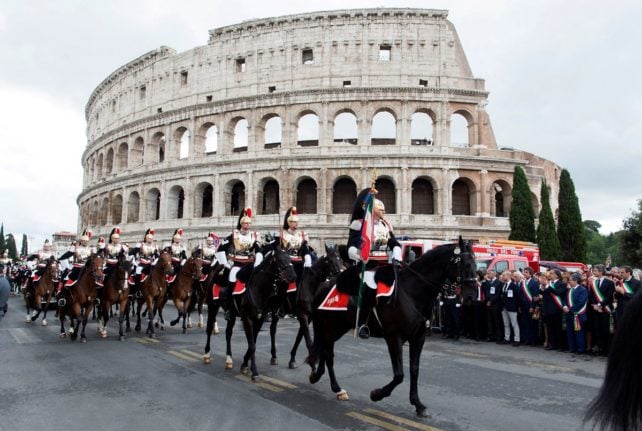 Members of Italy's Corrazzieri guard pictured in front of Rome's Colosseum