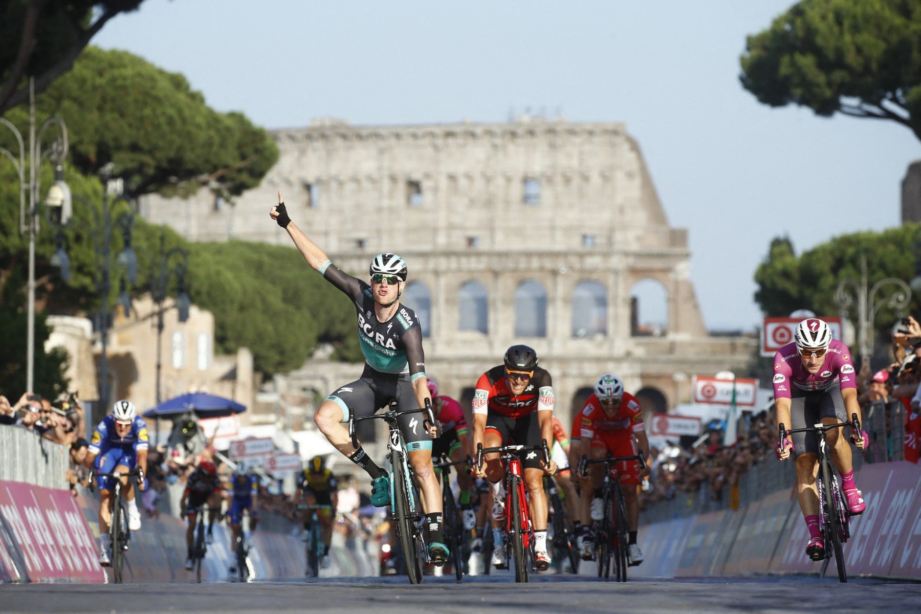 Bora Hansgrohe rider Sam Bennett celebrates as he crosses the finish line of the last stage of Italy's Giro d'Italia