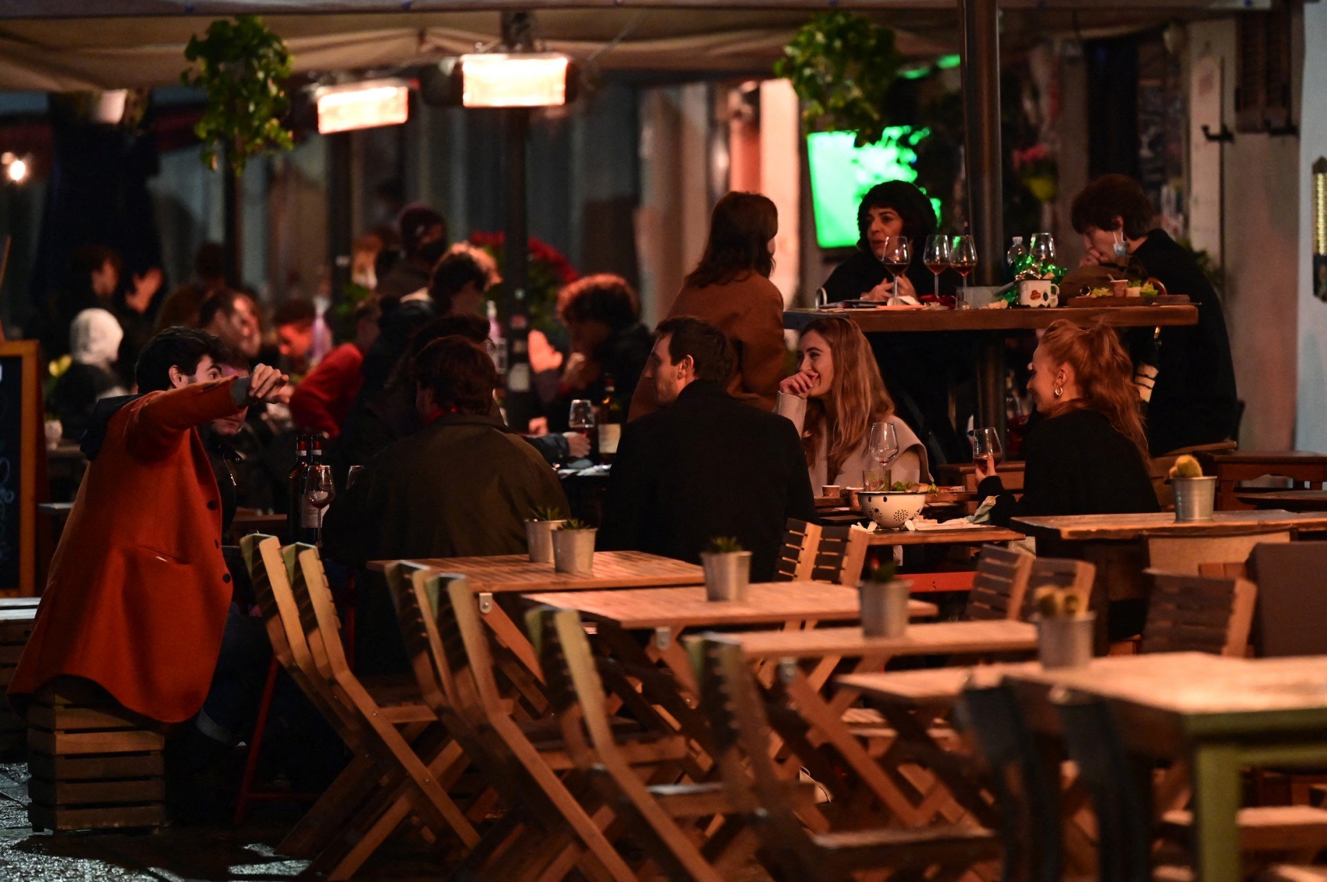 People pictured at a bar in southern Milan's Navigli district
